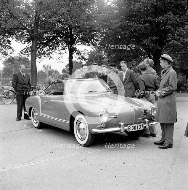 Young men admire the new Volkswagen Karmann Ghia, Landskrona, Sweden, 1955. Artist: Unknown