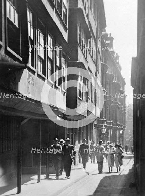People walking down Temple Lane, Westminster, London. Artist: Unknown