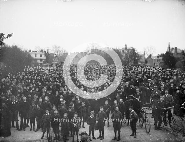 Large crowd on the bridge on May Morning to hear the college choir, Magdalen Bridge, Oxford, 1895. Creator: Henry Taunt.