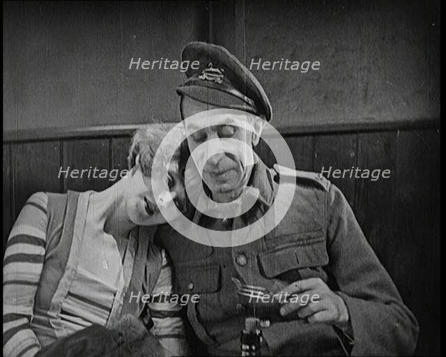 Scene from the Short Silent Feature Film 'Poppies of Flanders'. A Female Actor and a Male..., 1920s. Creator: British Pathe Ltd.