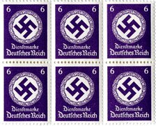 Set of postage stamps featuring a swastika emblem, 1941-1942. Artist: Unknown