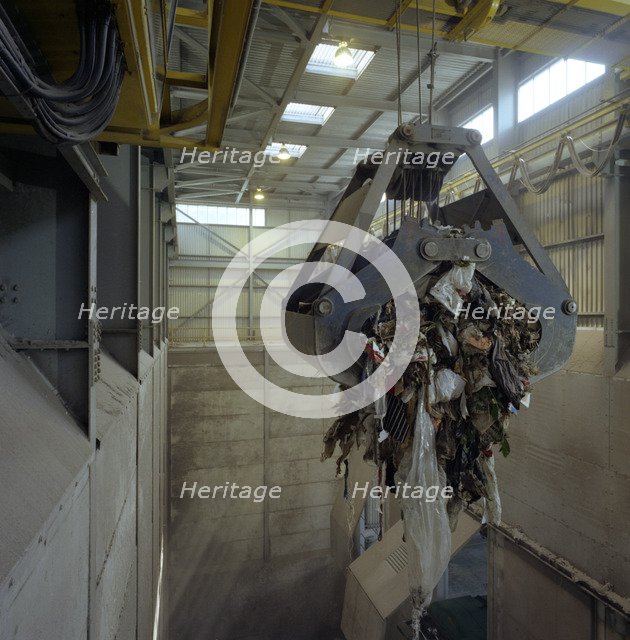 Waste ready for incineration in giant crane grab jaws, St Helier, Jersey, 1980.  Artist: Michael Walters