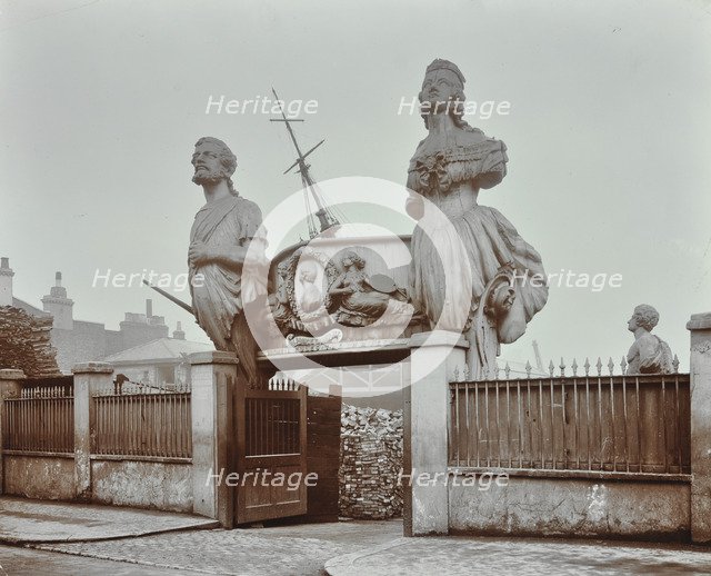 Huge figureheads at Castle's Ship Breaking Yard, Westminster, London, 1909. Artist: Unknown.