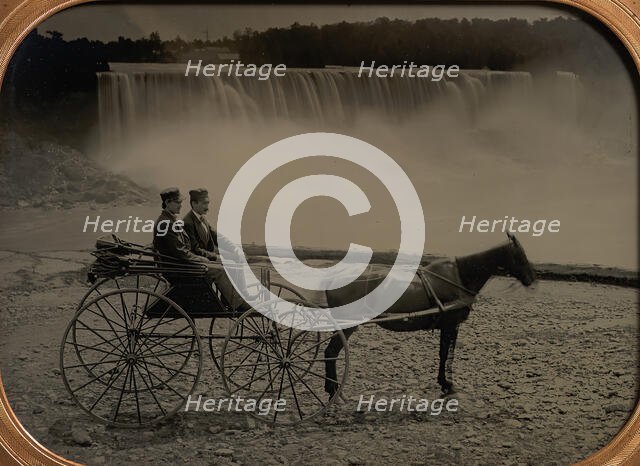 Two Men Seated in a Horse-Drawn Carriage in Front of Niagara Falls, 1860s. Creator: Unknown.