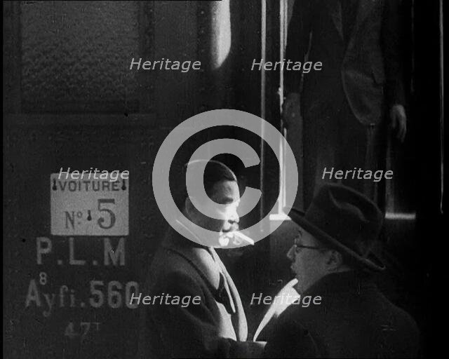 Japanese League of Nations Delegate Walking Past a Train, 1933. Creator: British Pathe Ltd.