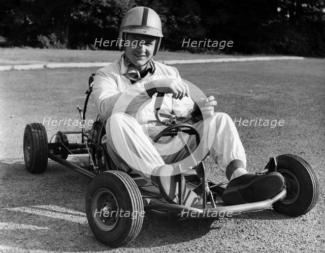 Bruce McLaren on his Em-Bee Wasp kart. Creator: Unknown.