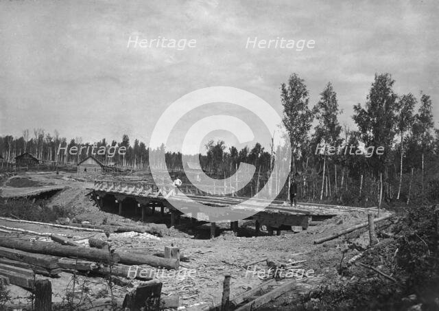 Construction of a Bridge 18 Sazhens Long Across the Khilok River on the Povarenskaia Road, 1909. Creator: Dorozhno-Stroitel'nyi Otdel.