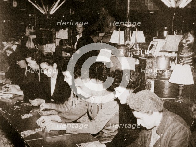 Automobile workers playing bingo at a carnival at Dearborn, Michigan, USA, c1938. Artist: Unknown