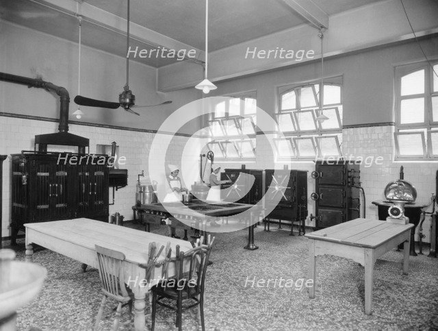 Two cooks working in the kitchen, Guy's Hospital, Southwark, London, 1925-1939. Artist: Marshall Keene and Company.