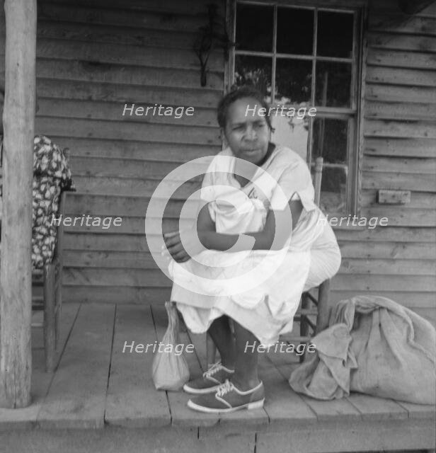 Possibly: Mother of sharecropper family and friend...the rain, Person County, North Carolina, 1939. Creator: Dorothea Lange.