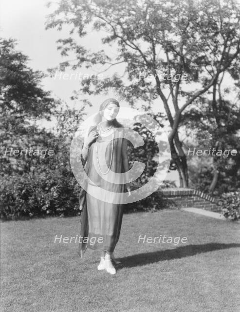 Person wearing a mask made by W.T. Benda, 1925 Sept. 20. Creator: Arnold Genthe.