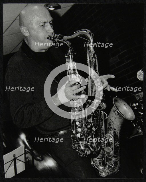 Kelvin Christiane playing two saxophones at The Fairway, Welwyn Garden City, Hertfordshire, 2002. Artist: Denis Williams