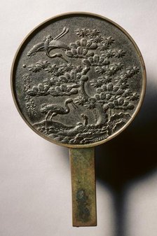 Mirror with Handle, Decorated with Pine Tree and Crane, early 17th - mid 19th century. Creator: Unknown.