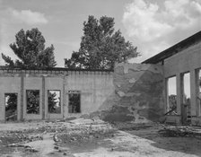 Some of the walls of the bank still stand at Fullerton, Louisiana, abandoned lumber town, 1937. Creator: Dorothea Lange.