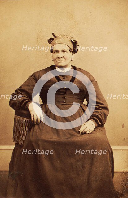 Portrait of seated woman wearing a headwrap, c1870. Creator: Thomas M Saurman.