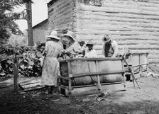 Families stringing tobacco brought in..., Granville County, North Carolina, 1939. Creator: Dorothea Lange.