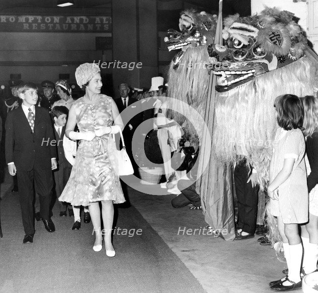 The Queen and Prince Andrew meet Singapore Forces dressed as lions at the Royal Tournament, 1972. Artist: Unknown