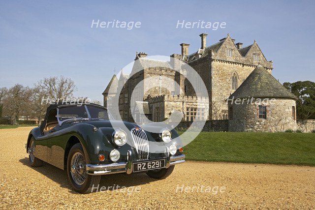 1954 Jaguar XK140 outside Palace House, Beaulieu Artist: Unknown.