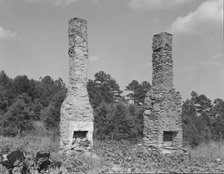 Standing chimneys of an old plantation house, Georgia, 1937. Creator: Dorothea Lange.
