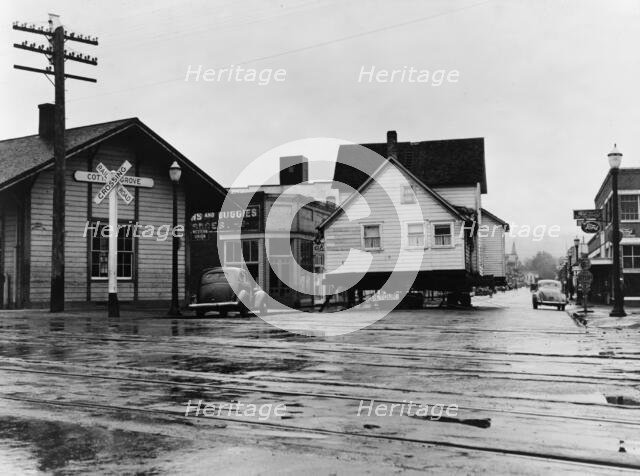 House being moved through the main street of town..., Cottage Grove, Lane County, Oregon, 1939. Creator: Dorothea Lange.