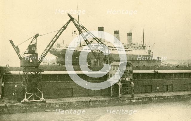 'Lifitng a "Majestic" (56,551 Tons) in the Floating Dock at Southampton', c1930. Creator: Unknown.