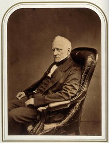 An unidentified man in an armchair. Creator: Maull & Polyblank.