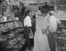 Interior of the grocery store patronized by Mrs. Ella Watson..., Washington, D.C., 1942. Creator: Gordon Parks.