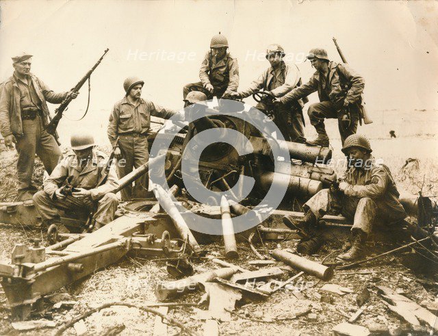 American troops looking for souvenir near Cherbourg airport, July 1944. Artist: Unknown