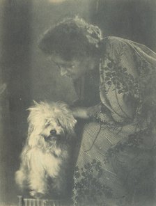 Seated woman petting her white dog, c1900. Creator: Virginia M Prall.