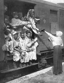 ''Les Turcos; Un arret dans une Gare d'un train de Tirailleurs', 1914. Creator: Unknown.
