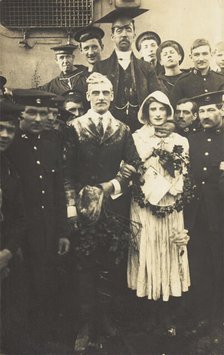 Sailors on HS Dominion, one in bridal drag, conduct a mock wedding on Christmas Day, 1915. Creator: Unknown.