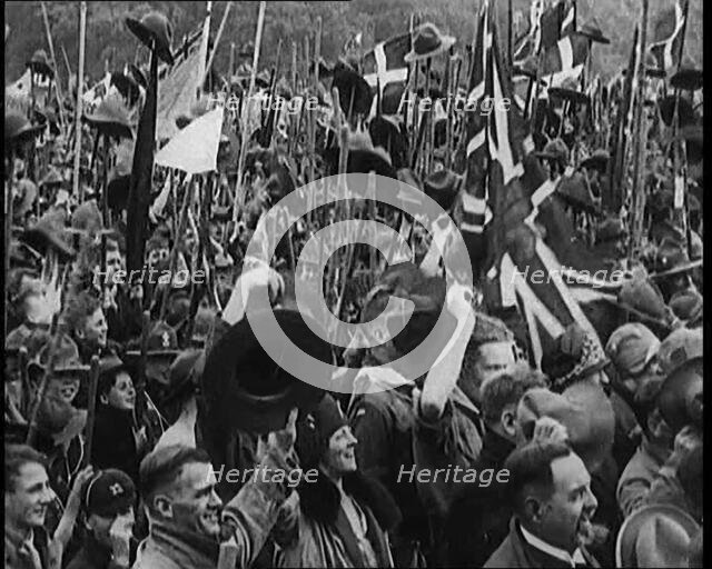 Large Numbers of Boy Scouts and Male Civilians Cheering at Jamboree, 1929. Creator: British Pathe Ltd.