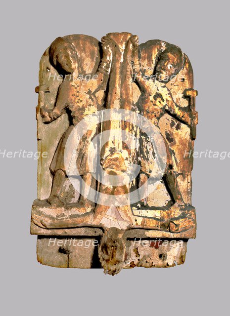 Crucifixion of St. Peter, 12th century carving.