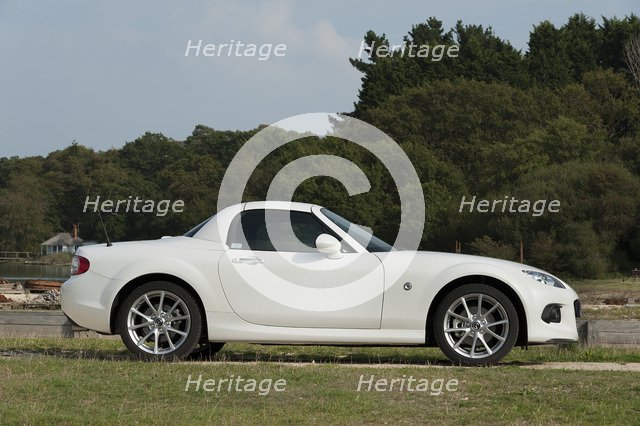 2014 Mazda MX5 Roadster Coupe Artist: Unknown.