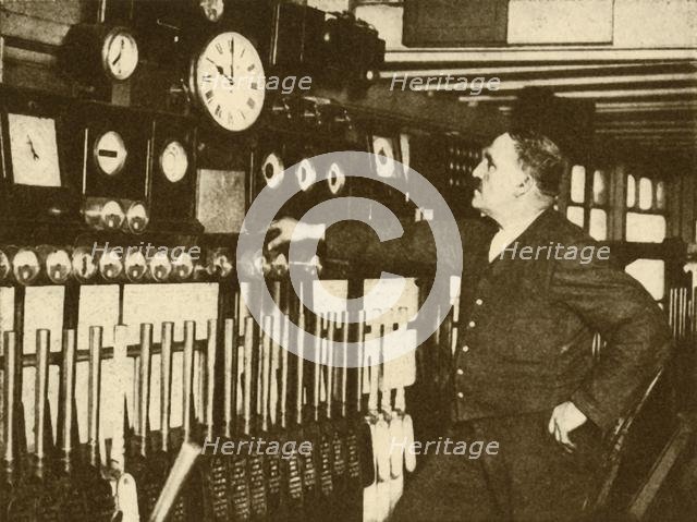 'Recording Daily Time Signal at Liverpool Street Station, London and North Eastern Railway', 1930. Creator: Topical Press Agency.