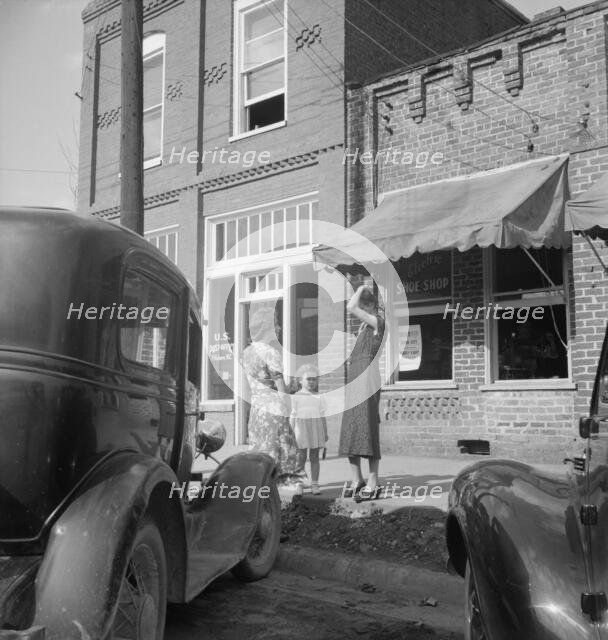 Street encounter on a Saturday afternoon, Pittsboro, North Carolina, 1939. Creator: Dorothea Lange.