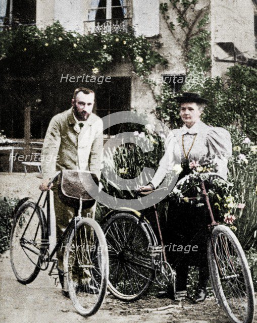Pierre and Marie Curie, French physicists, preparing to go cycling. Artist: Unknown.
