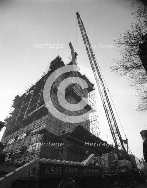 Crane lifting staircase carriageways into a new office building, Sheffield, South Yorkshire, 1961. Artist: Michael Walters