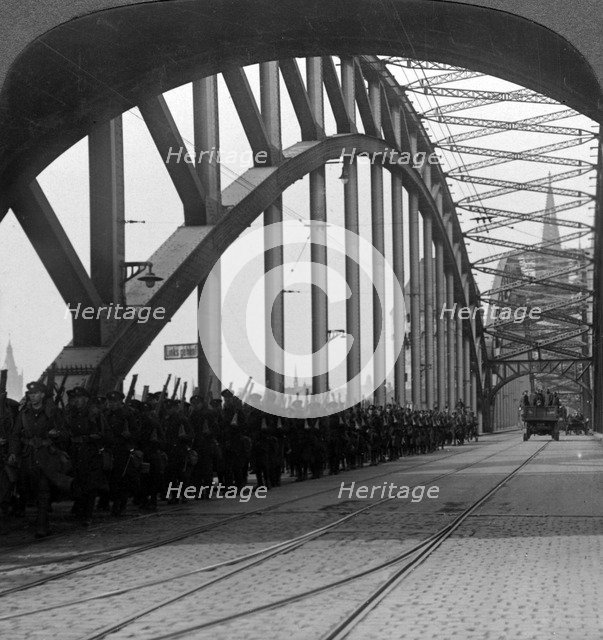 British troops crossing the bridge over the Rhine, Cologne, Germany, 1918-1926.Artist: Realistic Travels Publishers