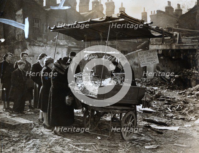 A fruit stall in a bomb wrecked clearing, London, World War II, c1940-c1945. Artist: Unknown