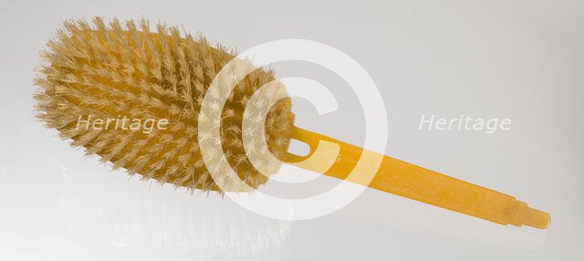 Bakelite hair brush from dresser set owned by Lena Horne, mid 20th Century. Creator: Agalin.