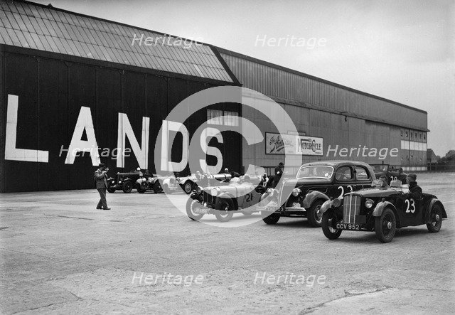 Morris, Ford V8 and MG PA Midget cars at the MCC Members Meeting, Brooklands, 10 September 1938. Artist: Bill Brunell.