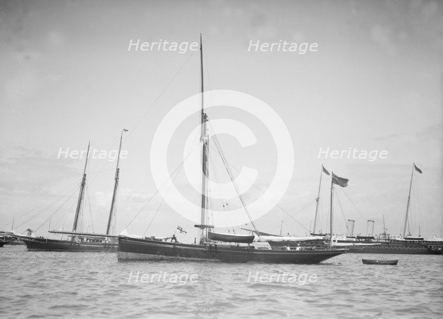 The yawl 'Beluga' at anchor, 1911. Creator: Kirk & Sons of Cowes.