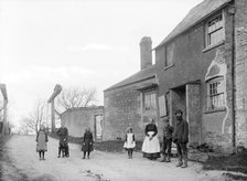 Family outside their cottage with the canal bridge in the background, Uffington, Oxfordshire, 1916. Artist: Henry Taunt
