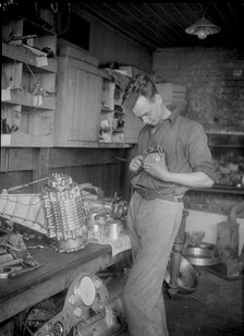 Mechanic working on Raymond Mays' 2996 cc Vauxhall-Villiers. Artist: Bill Brunell.