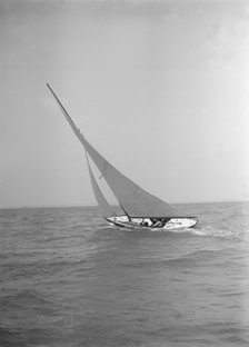 The 6 Metre class 'The Whim' sailing upwind, 1911. Creator: Kirk & Sons of Cowes.