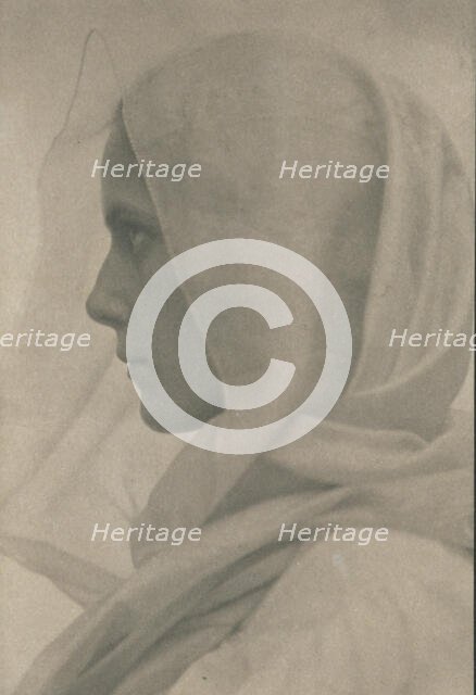 Profile portrait of woman draped with a veil, c1900. Creator: Amelia Van Buren.