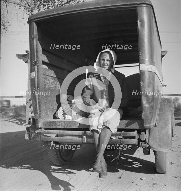 Migrant cotton picker on way to field, Kern migrant camp, California, 1936. Creator: Dorothea Lange.