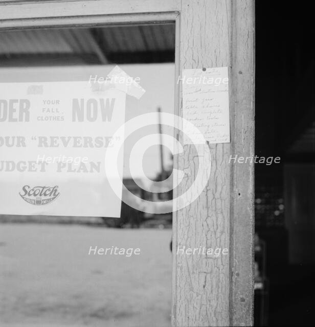 Sign on post office door: Farm animals and household equipment..., Vader, western Washington, 1939. Creator: Dorothea Lange.