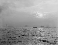Sunset off the Battery, New York harbor, ca 1900. Creator: Unknown.